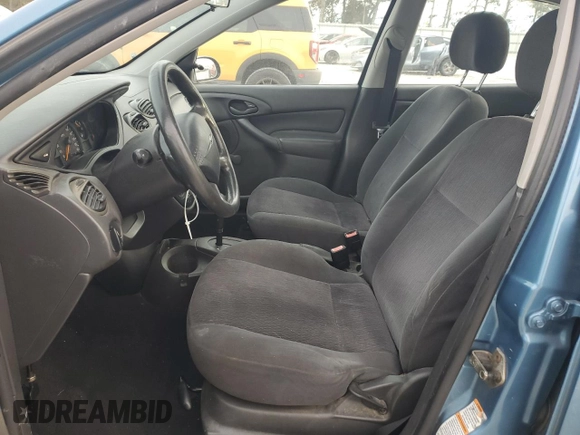 2001 Ford Focus LX with VIN 1FAHP33P01W332260, listed as a Copart auction lot 83221654 with 104,028 mi miles and Salvage Title. Bid and sale history available at DreamBid. Image 7.