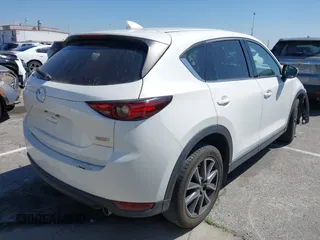 2018 Mazda CX-5 Grand Touring with VIN JM3KFADM8J0373368, listed as a IAAI auction lot 42013535 with 63,142 mi miles and . Bid and sale history available at DreamBid. Image 4.