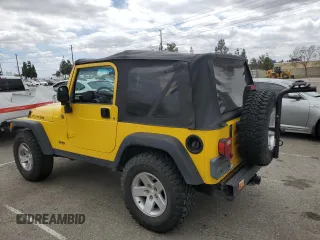 2004 Jeep Wrangler Rubicon with VIN 1J4FA69SX4P768963, listed as a Copart auction lot 56999665 with 91,949 mi miles and Salvage title. Bid and sale history available at DreamBid. Image 2.