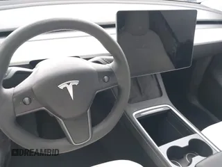2023 Tesla Model Y Long Range with VIN 7SAYGDEE1PA106057, listed as a IAAI auction lot 41778642 with 1 mi miles. Bid and sale history available at carsss.com. Image 19.