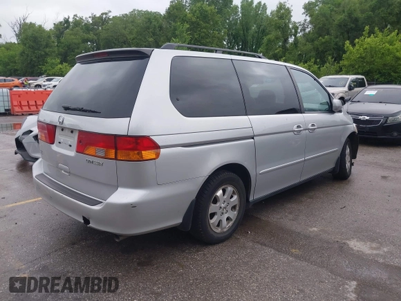 2004 Honda Odyssey EX-L with VIN 5FNRL18934B076486, listed as a IAAI auction lot 42315160 with 209,467 mi miles and . Bid and sale history available at DreamBid. Image 4.