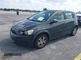 2014 Chevrolet Sonic LT with VIN 1G1JC6SB2E4115463, listed as a IAAI auction lot 42106600 with 135,652 mi miles. Bid and sale history available at carsss.com. Image 2.