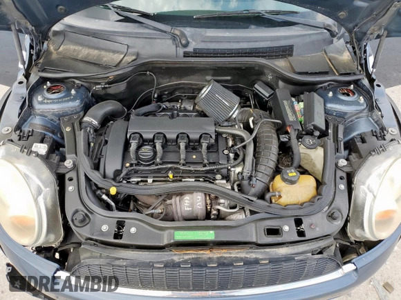 2010 MINI Hardtop S with VIN WMWMF7C51ATZ69061, listed as a Copart auction lot 60837465 with 102,506 mi miles and Salvage title. Bid and sale history available at DreamBid. Image 11.
