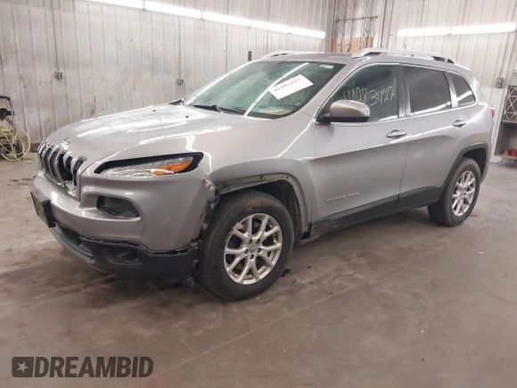 2014 Jeep Cherokee Altitude with VIN 1C4PJMCB9EW149754, listed as a IAAI auction lot 41983427 with 199,810 mi miles and . Bid and sale history available at DreamBid. Image 2.