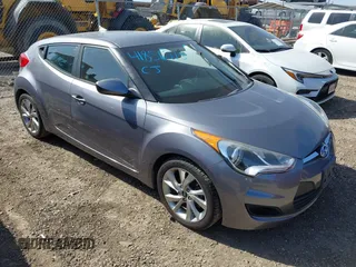 2016 Hyundai Veloster z VIN KMHTC6AD4GU296812, wystawiony jako IAAI lot #41856215 z przebiegiem 174 579 mil mil oraz . Historia ofert i sprzedaży dostępna na DreamBid. Obrazek 1.