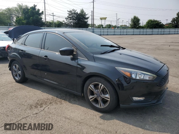 2018 Ford Focus SE z VIN 1FADP3F2XJL228407, wystawiony jako Copart lot #59254415 z przebiegiem 75 241 mil mil oraz Szkoda całkowita • Salvage title. Historia ofert i sprzedaży dostępna na DreamBid. Obrazek 4.