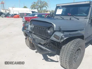 2003 Jeep Wrangler X with VIN 1J4FA39S03P314685, listed as a IAAI auction lot 41649741 with 119,924 mi miles. Bid and sale history available at carsss.com. Image 6.