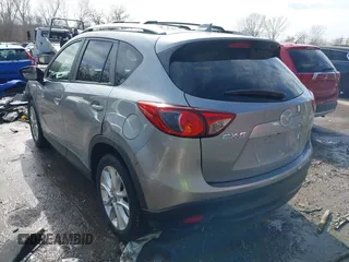 2014 Mazda CX-5 Grand Touring with VIN JM3KE2DY8E0375025, listed as a IAAI auction lot 41657755 with 103,601 mi miles. Bid and sale history available at carsss.com. Image 3.