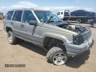 1997 Jeep Grand Cherokee Laredo z VIN 1J4GZ58S6VC636803, wystawiony jako Copart lot #59977115 z przebiegiem Nie podano mil oraz Szkoda całkowita • Salvage title. Historia ofert i sprzedaży dostępna na DreamBid. Obrazek 4.