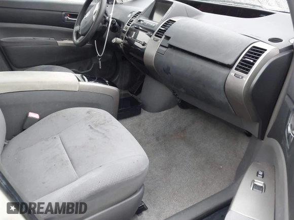 2007 Toyota Prius z VIN JTDKB20U177622142, wystawiony jako IAAI lot #41720920 z przebiegiem 140 665 mil mil oraz . Historia ofert i sprzedaży dostępna na DreamBid. Obrazek 5.
