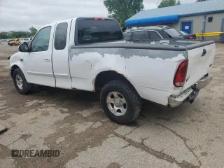 2002 Ford F-150 XL with VIN 1FTRX17L52KC49698, listed as a Copart auction lot 54307145 with 254,394 mi miles and Salvage title. Bid and sale history available at DreamBid. Image 2.