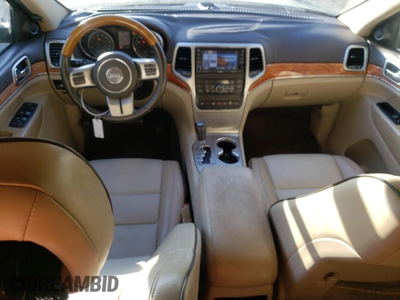 2011 Jeep Grand Cherokee Overland with VIN 1J4RS6GG7BC646610, listed as a Copart auction lot 79931614 with 188,601 mi miles and Salvage Title. Bid and sale history available at DreamBid. Image 8.
