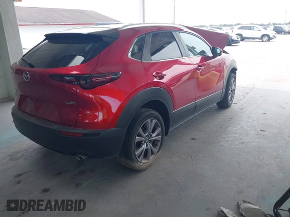 2023 Mazda CX-30 S Carbon Edition with VIN 3MVDMBCM3PM537841, listed as a IAAI auction lot 42080487 with 22,718 mi miles and . Bid and sale history available at DreamBid. Image 4.