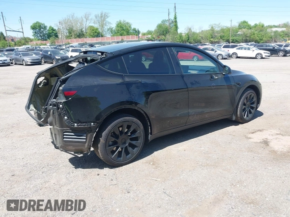2023 Tesla Model Y Long Range with VIN 7SAYGDEE0PA111430, listed as a IAAI auction lot 42156924 with 35,950 mi miles and . Bid and sale history available at DreamBid. Image 4.