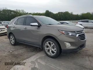 2019 Chevrolet Equinox Premier with VIN 3GNAXNEV8KS561549, listed as a Copart auction lot 54332695 with 124,774 mi miles and Salvage title. Bid and sale history available at DreamBid. Image 4.