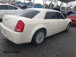 2006 Chrysler 300 with VIN 2C3KA43RX6H470150, listed as a IAAI auction lot 41767272 with 107,457 mi miles. Bid and sale history available at carsss.com. Image 4.