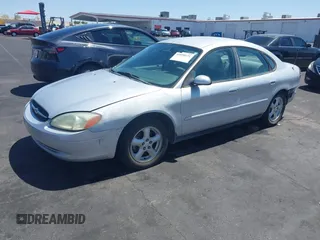 2003 Ford Taurus SE Standard with VIN 1FAFP53UX3G268265, listed as a IAAI auction lot 42090151 with 139,734 mi miles. Bid and sale history available at carsss.com. Image 2.