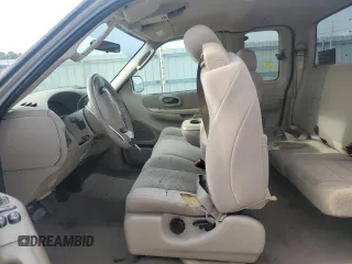 2003 Ford F-150 XL with VIN 1FTRX17LX3NA38576, listed as a Copart auction lot 54057495 with 173,811 mi miles and Salvage title. Bid and sale history available at DreamBid. Image 7.
