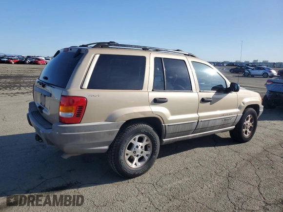 1999 Jeep Grand Cherokee Laredo z VIN 1J4GW58NXXC704719, wystawiony jako Copart lot #49546395 z przebiegiem 276 716 mil mil oraz Czysty tytuł • Clean title. Historia ofert i sprzedaży dostępna na DreamBid. Obrazek 3.