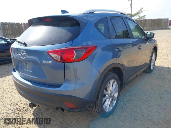 2015 Mazda CX-5 Grand Touring with VIN JM3KE4DY5F0469098, listed as a IAAI auction lot 41858792 with 174,883 mi miles. Bid and sale history available at carsss.com. Image 4.
