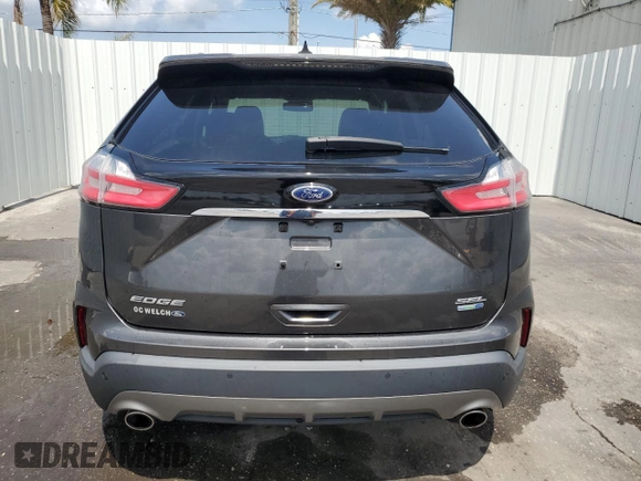 2020 Ford Edge SEL с VIN 2FMPK4J95LBB17293, выставлен на аукционе Copart как лот 58796255 с пробегом 82 583 миль миль и Чистый • Clean title. История ставок и продаж доступна на DreamBid. Изображение 6.