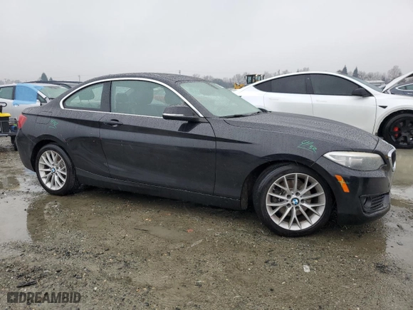 2014 BMW 2 Series 228i with VIN WBA1F5C51EVV99277, listed as a Copart auction lot 87306954 with 73,211 mi miles and Salvage Title. Bid and sale history available at carsss.com. Image 4.