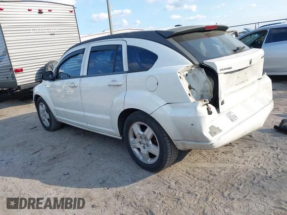 2009 Dodge Caliber SXT with VIN 1B3HB48A69D130857, listed as a IAAI auction lot 41526199 with 163,796 mi miles and . Bid and sale history available at DreamBid. Image 14.