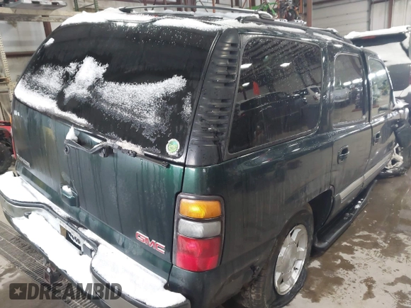 2004 GMC Yukon SLT with VIN 1GKEK13ZX4R198169, listed as a IAAI auction lot 41577015 with 169,562 mi miles. Bid and sale history available at carsss.com. Image 4.