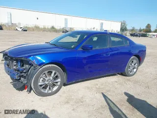 2021 Dodge Charger SXT with VIN 2C3CDXJG0MH601422, listed as a IAAI auction lot 40644896 with 64,836 mi miles. Bid and sale history available at carsss.com. Image 2.