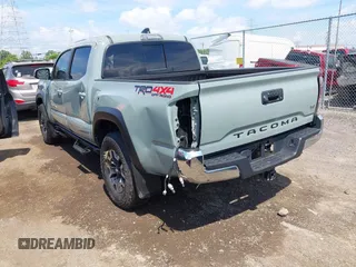 2023 Toyota Tacoma SR with VIN 3TMCZ5AN1PM581266, listed as a IAAI auction lot 42371395 with 32,582 mi miles and . Bid and sale history available at DreamBid. Image 3.