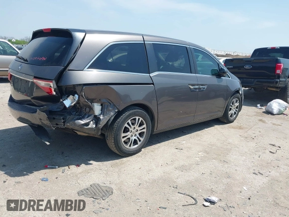 2012 Honda Odyssey EX with VIN 5FNRL5H41CB011940, listed as a IAAI auction lot 42033966 with 182,996 mi miles and . Bid and sale history available at DreamBid. Image 4.