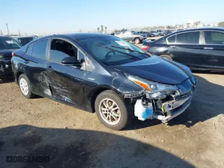 2021 Toyota Prius L Eco with VIN JTDKAMFU1M3134107, listed as a IAAI auction lot 41763080 with 185,248 mi miles. Bid and sale history available at carsss.com. Image 1.