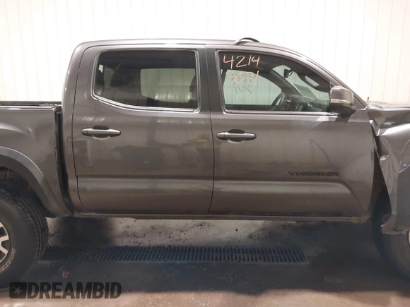 2019 Toyota Tacoma SR with VIN 5TFCZ5AN7KX208672, listed as a IAAI auction lot 42143071 with 83,584 mi miles and . Bid and sale history available at DreamBid. Image 14.