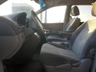 2010 Toyota Sienna CE with VIN 5TDKK4CC6AS329753, listed as a Copart auction lot 54374515 with 144,654 mi miles and Salvage Title. Bid and sale history available at DreamBid. Image 7.