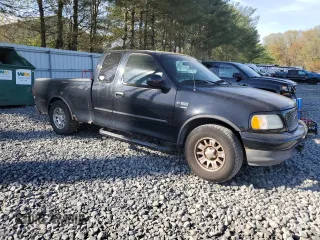 2002 Ford F-150 XL with VIN 1FTRX17L42NB06983, listed as a Copart auction lot 54172855 with 150,243 mi miles and Salvage title. Bid and sale history available at DreamBid. Image 4.