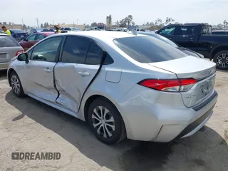 2022 Toyota Corolla Hybrid LE with VIN JTDEAMDE6NJ056705, listed as a IAAI auction lot 42032119 with 197,030 mi miles. Bid and sale history available at carsss.com. Image 3.