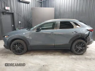 2022 Mazda CX-30 S Carbon Edition with VIN 3MVDMBCL8NM447234, listed as a IAAI auction lot 42511600 with 51,926 mi miles and . Bid and sale history available at DreamBid. Image 14.