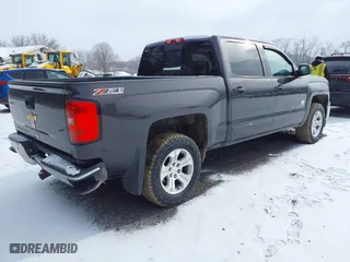2015 Chevrolet Silverado 1500 LT with VIN 3GCUKREC3FG460485, listed as a IAAI auction lot 41616998 with 128,049 mi miles. Bid and sale history available at carsss.com. Image 4.