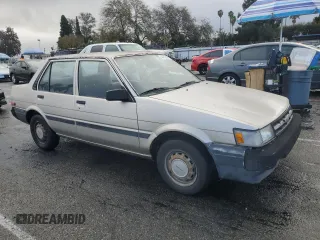 1987 Toyota Corolla с VIN JT2AE82E9H3531391, выставлен на аукционе Copart как лот 44657375 с пробегом 240 376 миль миль и Чистый • Clean title. История ставок и продаж доступна на DreamBid. Изображение 4.