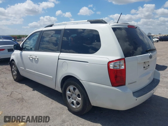2010 Kia Sedona LX with VIN KNDMG4C33A6338047, listed as a IAAI auction lot 42128485 with 99,498 mi miles and . Bid and sale history available at carsss.com. Image 3.