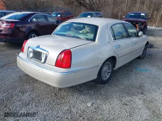 2001 Lincoln Town Car Cartier with VIN 1LNHM83W81Y669301, listed as a IAAI auction lot 41491977 with NaN miles. Bid and sale history available at carsss.com. Image 4.