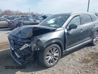 2021 Mazda CX-9 Signature with VIN JM3TCBEY5M0523199, listed as a IAAI auction lot 41916480 with 56,772 mi miles. Bid and sale history available at carsss.com. Image 2.
