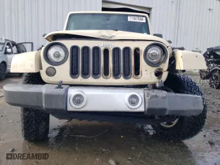 2011 Jeep Wrangler Unlimited Sahara with VIN 1J4BA5H19BL593658, listed as a Copart auction lot 71947684 with 122,323 mi miles and Salvage Title. Bid and sale history available at carsss.com. Image 5.