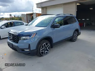 2023 Honda Passport Elite with VIN 5FNYF8H03PB000039, listed as a IAAI auction lot 40593339 with 33,697 mi miles and . Bid and sale history available at DreamBid. Image 2.