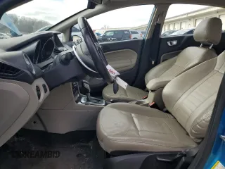 2015 Ford Fiesta Titanium z VIN 3FADP4FJ7FM120958, wystawiony jako Copart lot #85260204 z przebiegiem 144 587 mil mil oraz Szkoda całkowita • Salvage title. Historia ofert i sprzedaży dostępna na DreamBid. Obrazek 7.