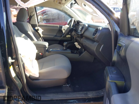 2018 Toyota Tacoma SR with VIN 5TFCZ5ANXJX124991, listed as a IAAI auction lot 41136867 with 57,980 mi miles and . Bid and sale history available at carsss.com. Image 5.