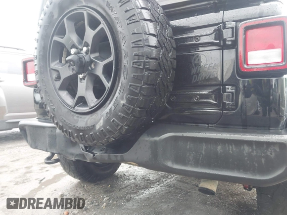 2021 Jeep Wrangler Unlimited Sport S with VIN 1C4HJXDN0MW678801, listed as a IAAI auction lot 42211815 with 96,849 mi miles and . Bid and sale history available at DreamBid. Image 17.