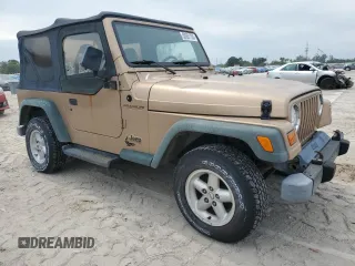 1999 Jeep Wrangler SE with VIN 1J4FY29P2XP451036, listed as a Copart auction lot 50551755 with 0 mi miles and Salvage Title. Bid and sale history available at carsss.com. Image 4.