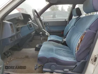 1984 Toyota Camry z VIN JT2SV16E3E0220882, wystawiony jako Copart lot #53514345 z przebiegiem 112 430 mil mil oraz Czysty tytuł • Clean title. Historia ofert i sprzedaży dostępna na DreamBid. Obrazek 7.