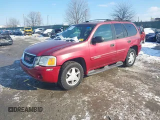 2003 GMC Envoy SLE with VIN 1GKDT13S732131869, listed as a IAAI auction lot 41422135 with 163,193 mi miles. Bid and sale history available at carsss.com. Image 2.